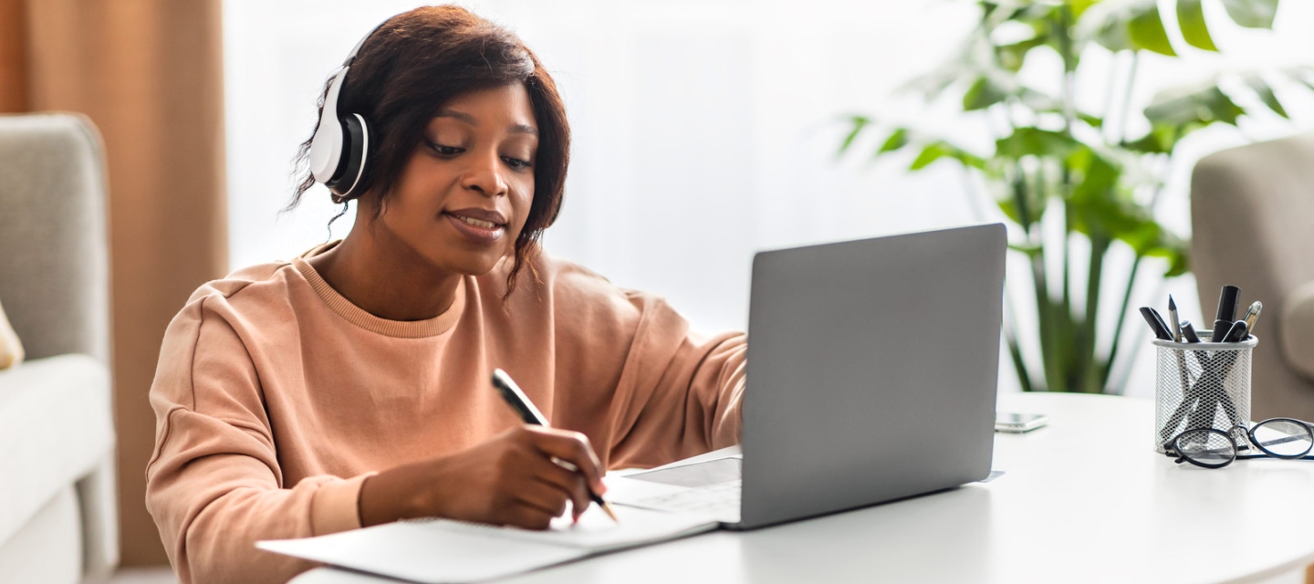 Student using a laptop at a table